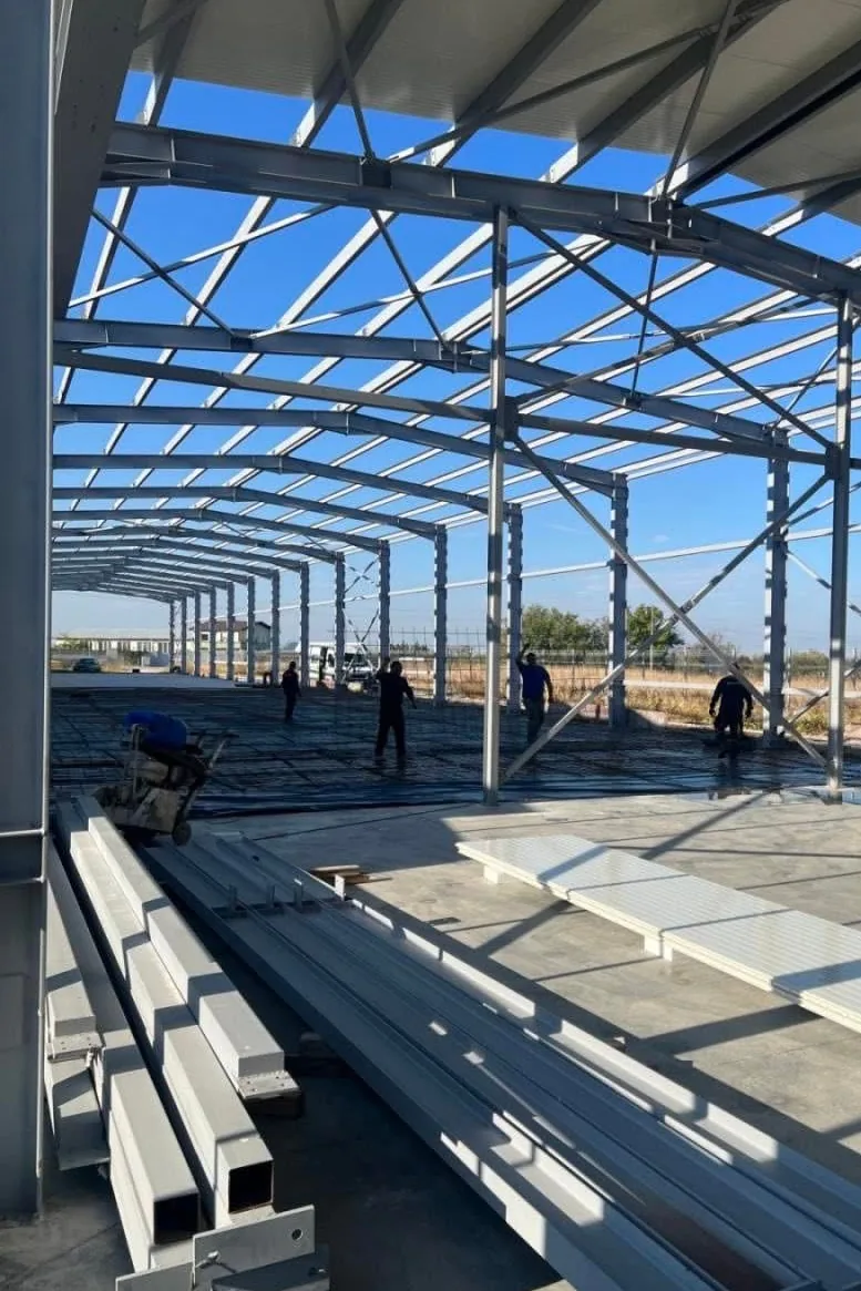Steel portal frame structure during erection on site